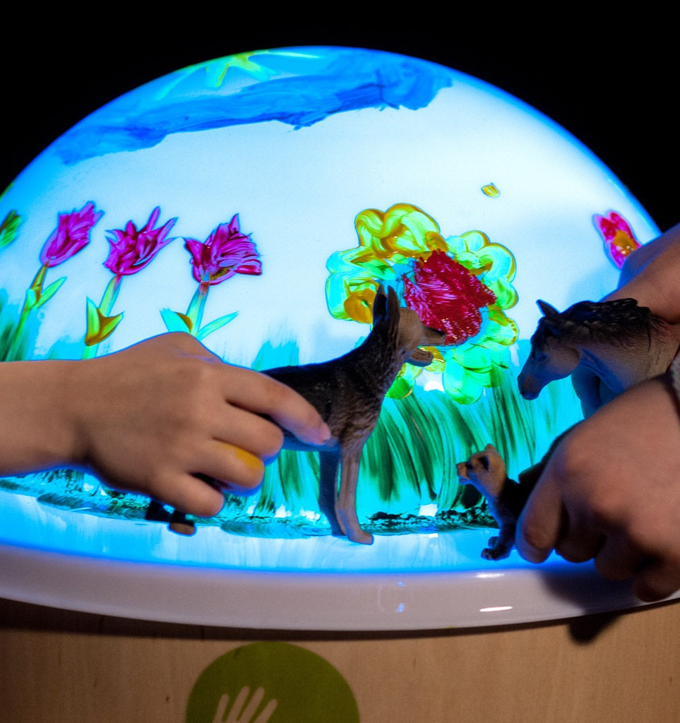 Child engaged in open-ended play with Jonely’s Magic Light Table, exploring colour and light