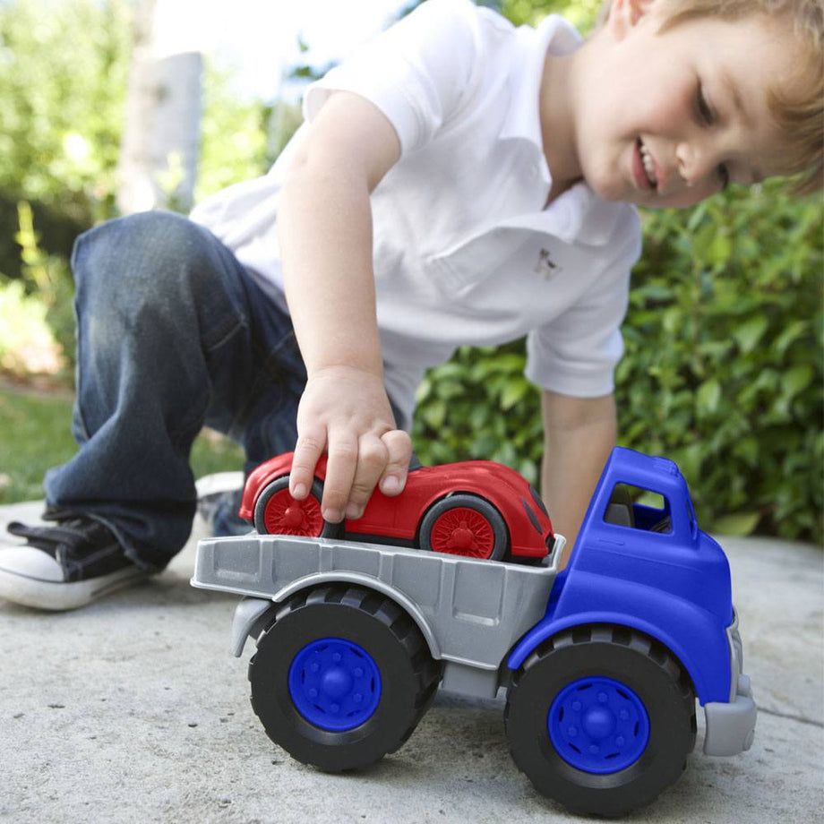Green toys flatbed truck and shop race car